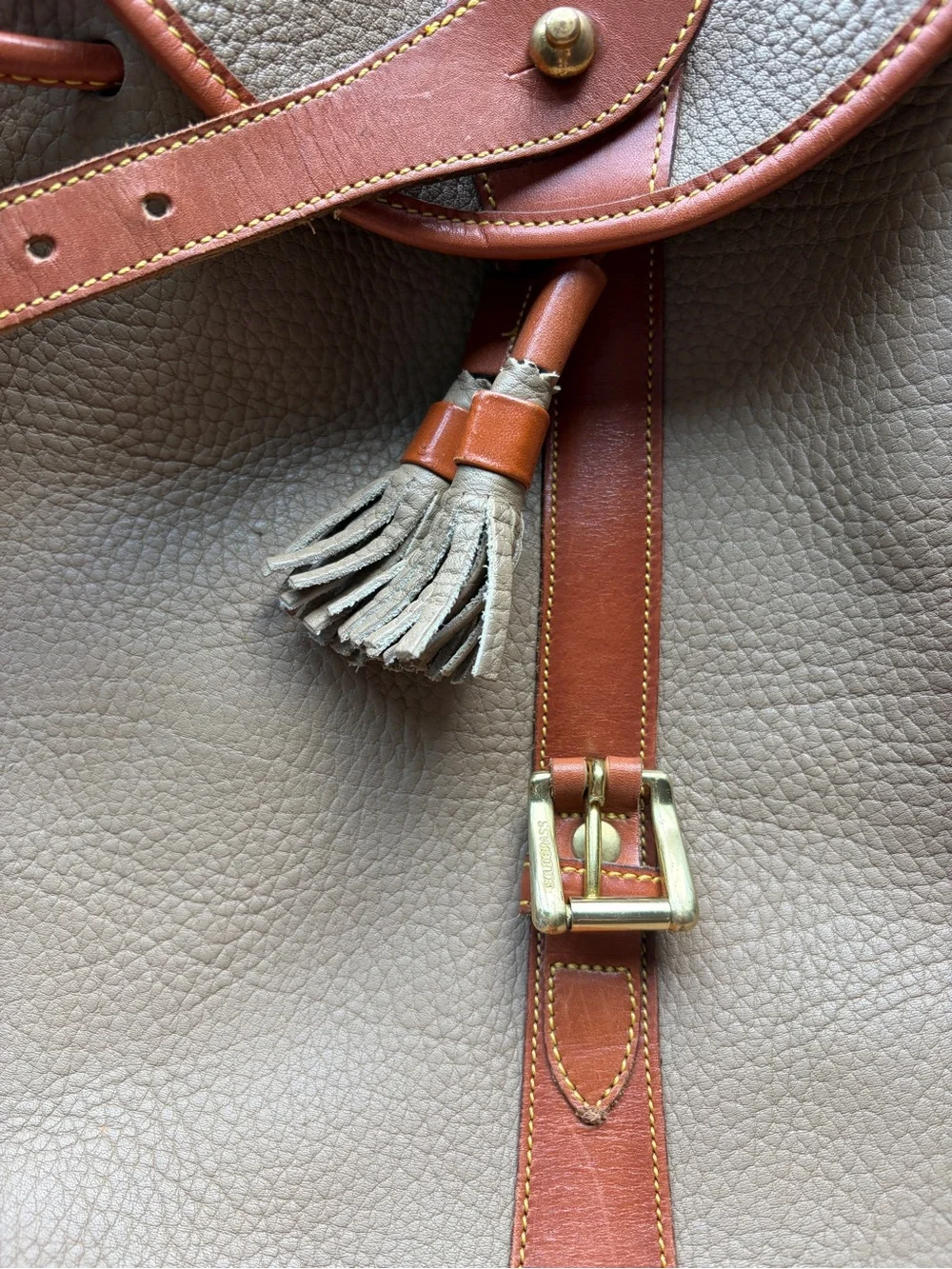 Dooney & Bourke Beige Leather Drawstring Backpack with Tan Trim